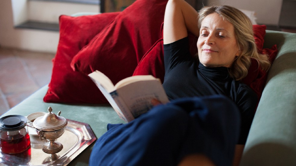 woman reading on sofa